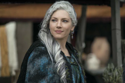 HD desktop wallpaper of Katheryn Winnick as Lagertha from the TV show Vikings. She is dressed in period costume with braided white hair, exuding a strong and regal presence.