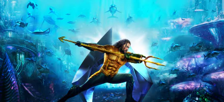 HD PC desktop wallpaper of Jason Momoa as Aquaman, wielding his trident underwater with sea creatures surrounding him in a dynamic movie-inspired scene.