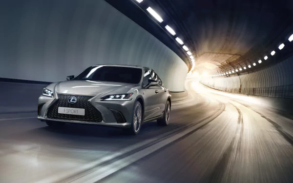 Silver Lexus ES 300H sedan racing through an illuminated tunnel with motion blur — 4K Ultra HD PC desktop wallpaper.