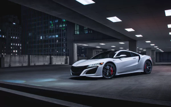 Sleek white Acura NSX supercar parked in an urban rooftop setting at night, showcased in sharp 4K Ultra HD resolution as a desktop wallpaper background.