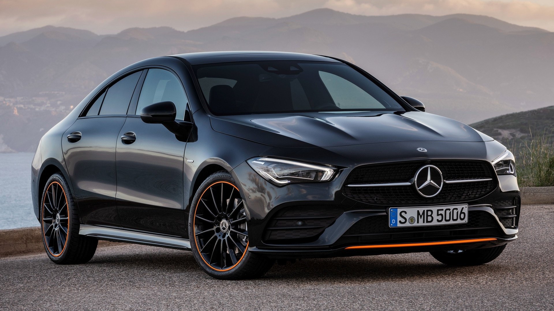 Black Mercedes-Benz CLA-Class parked with mountain backdrop, showcased as an HD PC desktop wallpaper and background featuring sleek vehicle design.