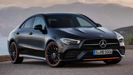 Black Mercedes-Benz CLA-Class parked with mountain backdrop, showcased as an HD PC desktop wallpaper and background featuring sleek vehicle design.