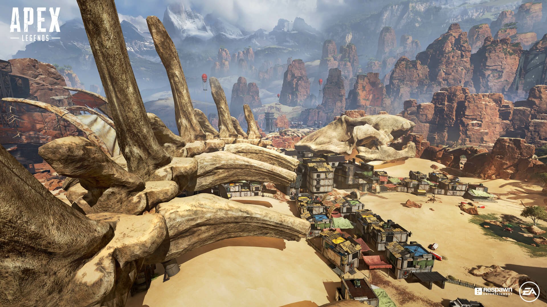 Apex Legends video game HD PC desktop wallpaper/background: desert canyon battlefield with massive rib-like bones arching over a small outpost and rocky mesas under a cloudy sky.