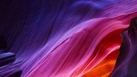 Vibrant flowing sandstone waves in Antelope Canyon in vivid purple, pink and orange — HD PC desktop wallpaper and nature background.