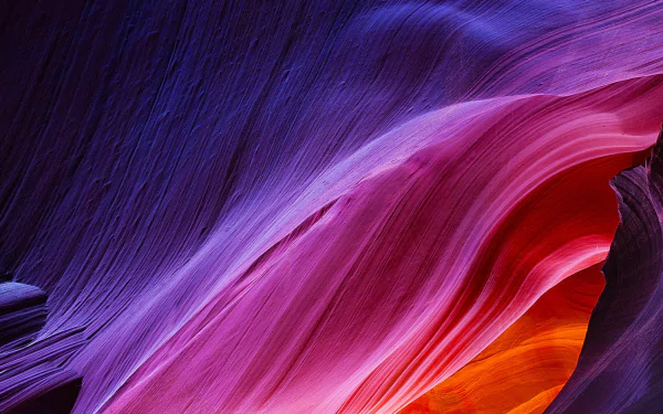 Vibrant flowing sandstone waves in Antelope Canyon in vivid purple, pink and orange — HD PC desktop wallpaper and nature background.