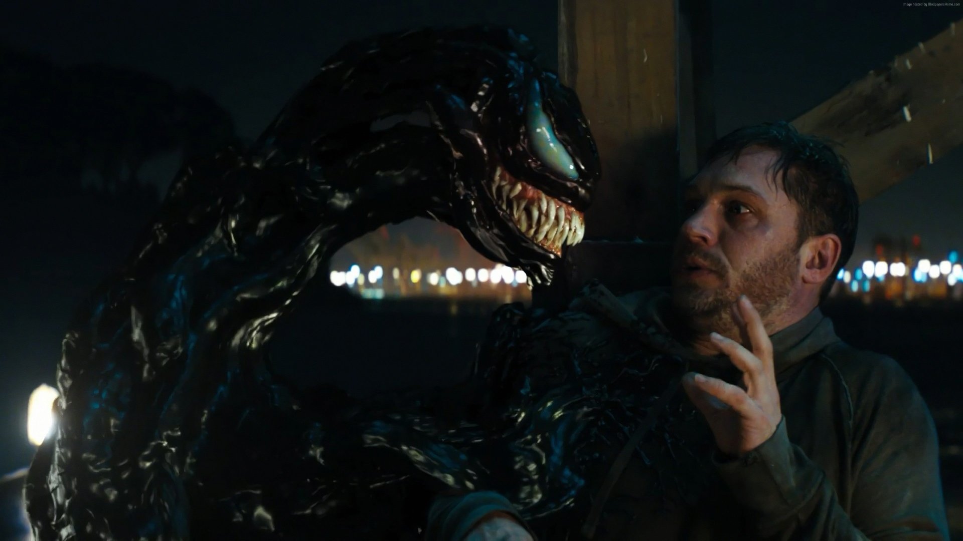 Tom Hardy as Eddie Brock with Venom in a dark, intense scene from the movie Venom, featured in a 4K Ultra HD PC desktop wallpaper and background.