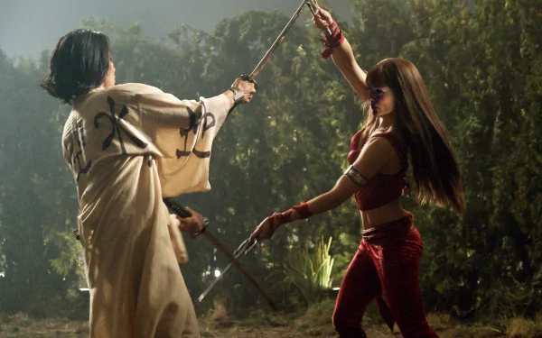 HD PC desktop wallpaper featuring a dynamic fight scene from the movie Elektra, showcasing two characters engaged in sword combat in a forest setting.